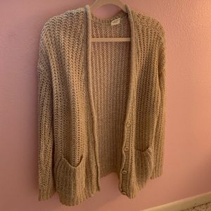Crocheted sweater with pockets and buttons